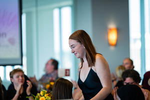 Tymbar Williamson smiles and walks to the podium to receive an award