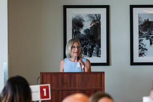 Cyndee Stull speaks behind a podium