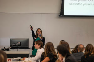 Susan Wold speaks to a group of students 