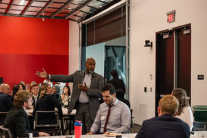 Dean Keith Mays speaks to a crowd of students