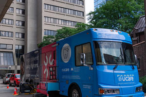 Mobile Dental Clinic bus parked outside Moos Tower
